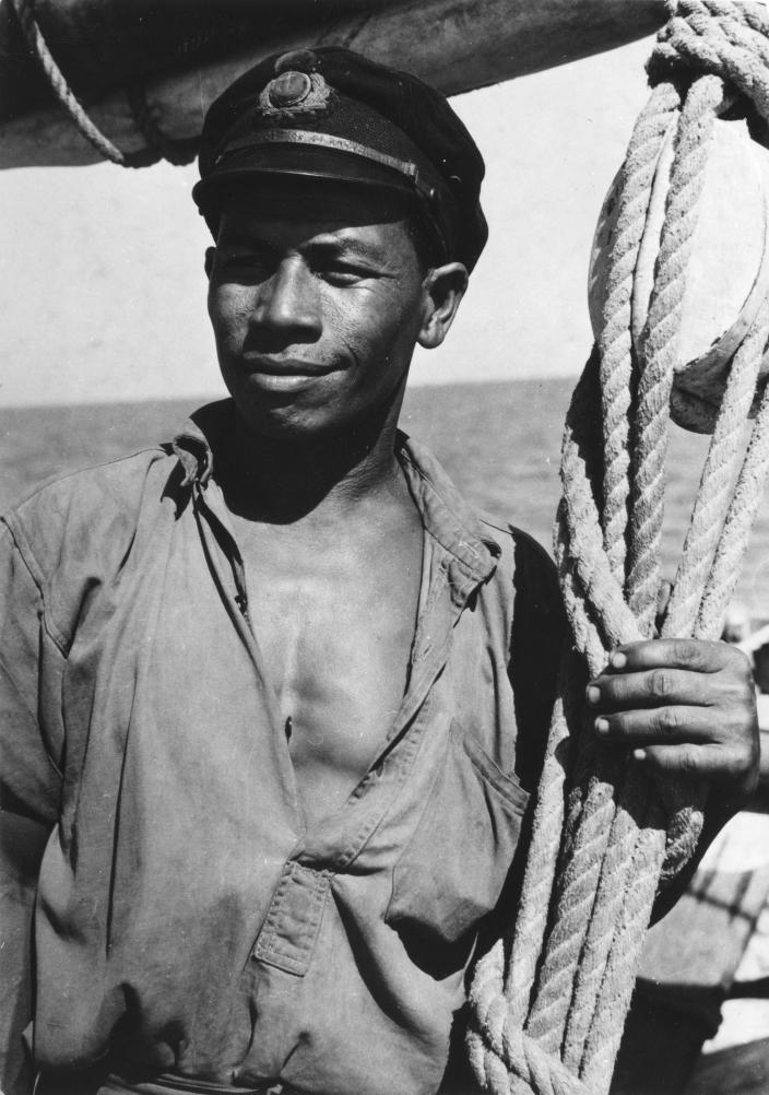Portrait of a man standing on a boat.